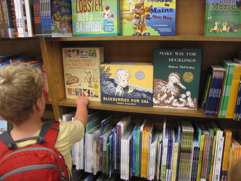 harvey in the bookstore looking at robert mccloskey books